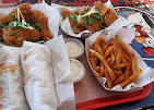 Crispy Kitchen chicken meal with fries and dipping sauces