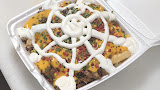 Loaded fries topped with meat, sauce and onions